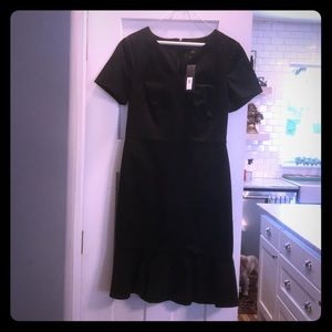 Black stretch knit dress with peplum